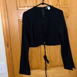 Black crop top with open front. Size XL. Never worn. No stains or tears.